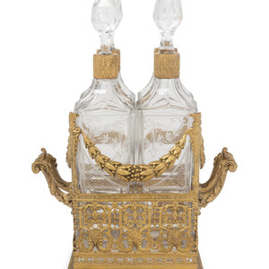 Appraisal: A French Gilt Metal and Glass Four-Bottle Decanter Caddy th