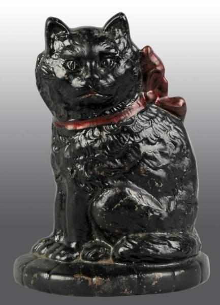 Appraisal: Cast Iron Cat with Bow on Pillow Doorstop Description Marked