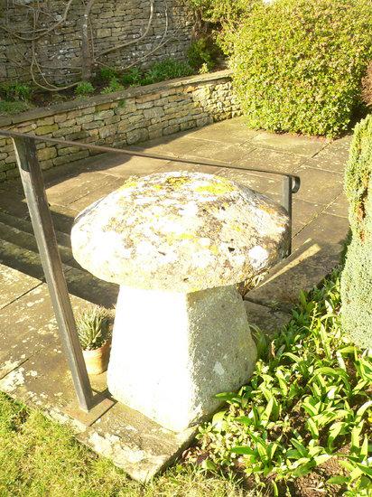 Appraisal: A staddle stone and a tapered base cm high