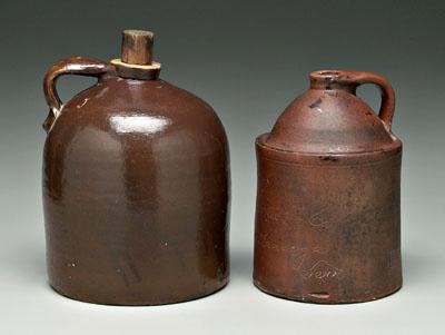 Appraisal: Two stoneware jugs one with brown glaze incised on side