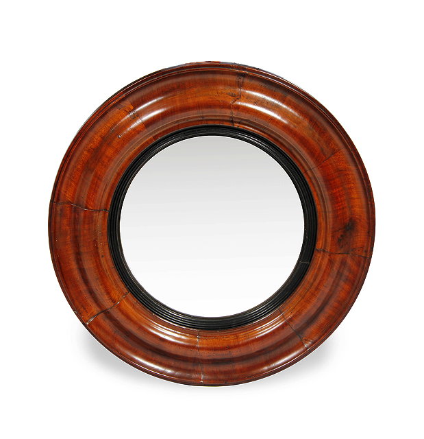 Appraisal: A REGENCY CONVEX WALL MIRROR with mahogany cushion moulded frame