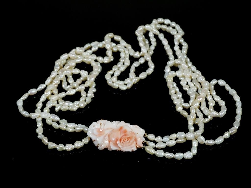 Appraisal: Triple strand freshwater pearl necklace with carved rose quartz and