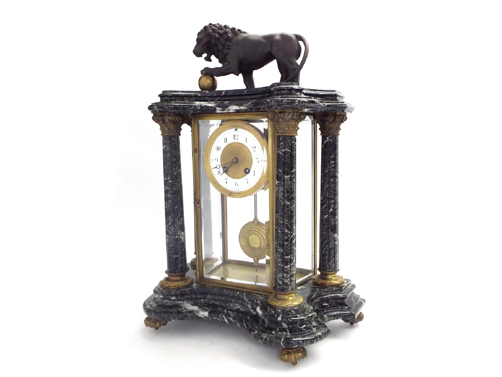 Appraisal: French dark green marble two train four glass mantel clock