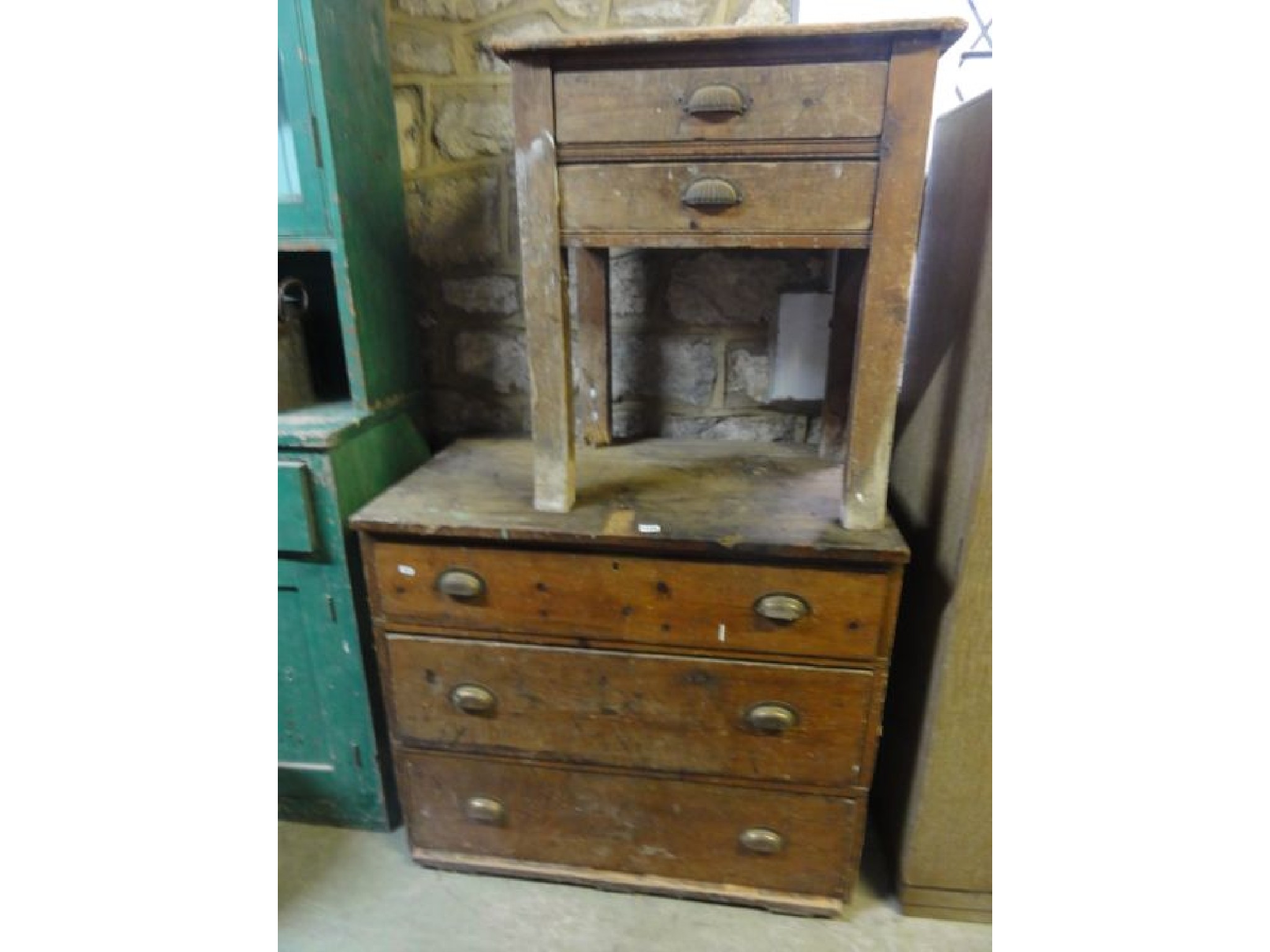 Appraisal: A vintage stained pine chest of three long drawers together