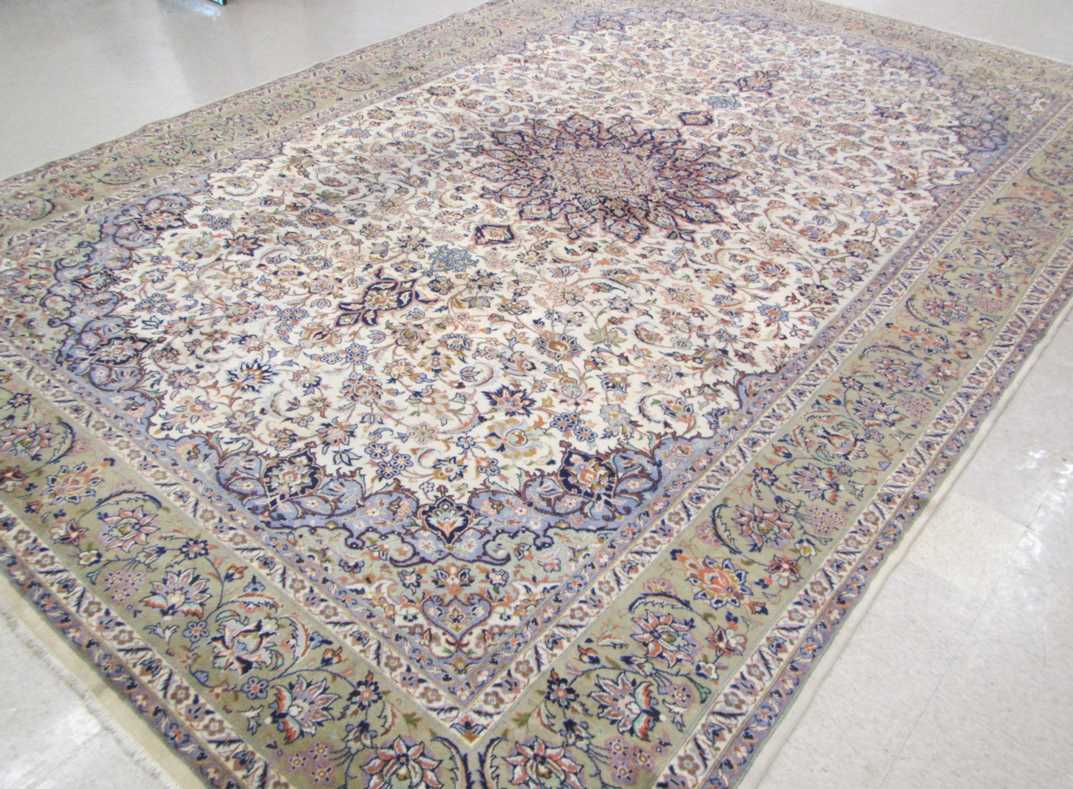 Appraisal: LARGE HAND KNOTTED PERSIAN CARPET floral and central floral medallion