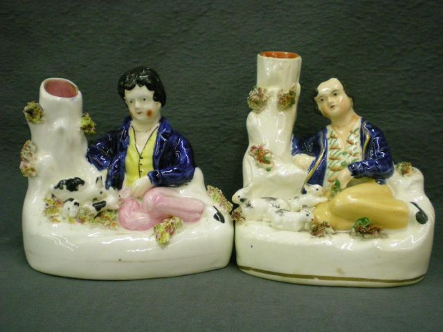 Appraisal: Two Staffordshire figural spills including spill with boy and three