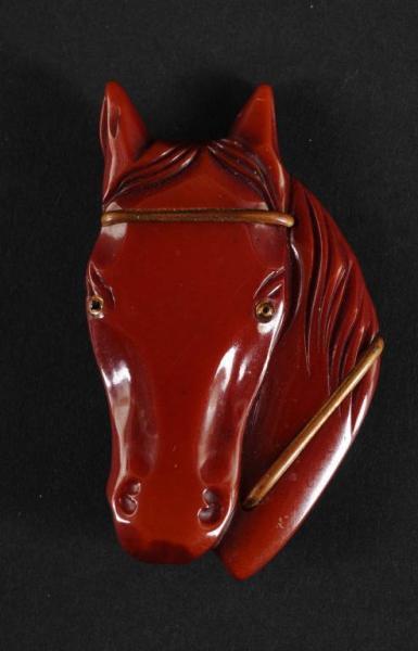 Appraisal: Bakelite Dark Red Horse Head Pin Condition Excellent