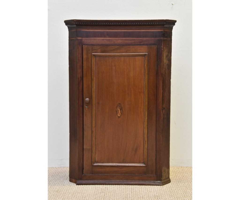 Appraisal: Georgian mahogany hanging corner cabinet early th c door inlaid