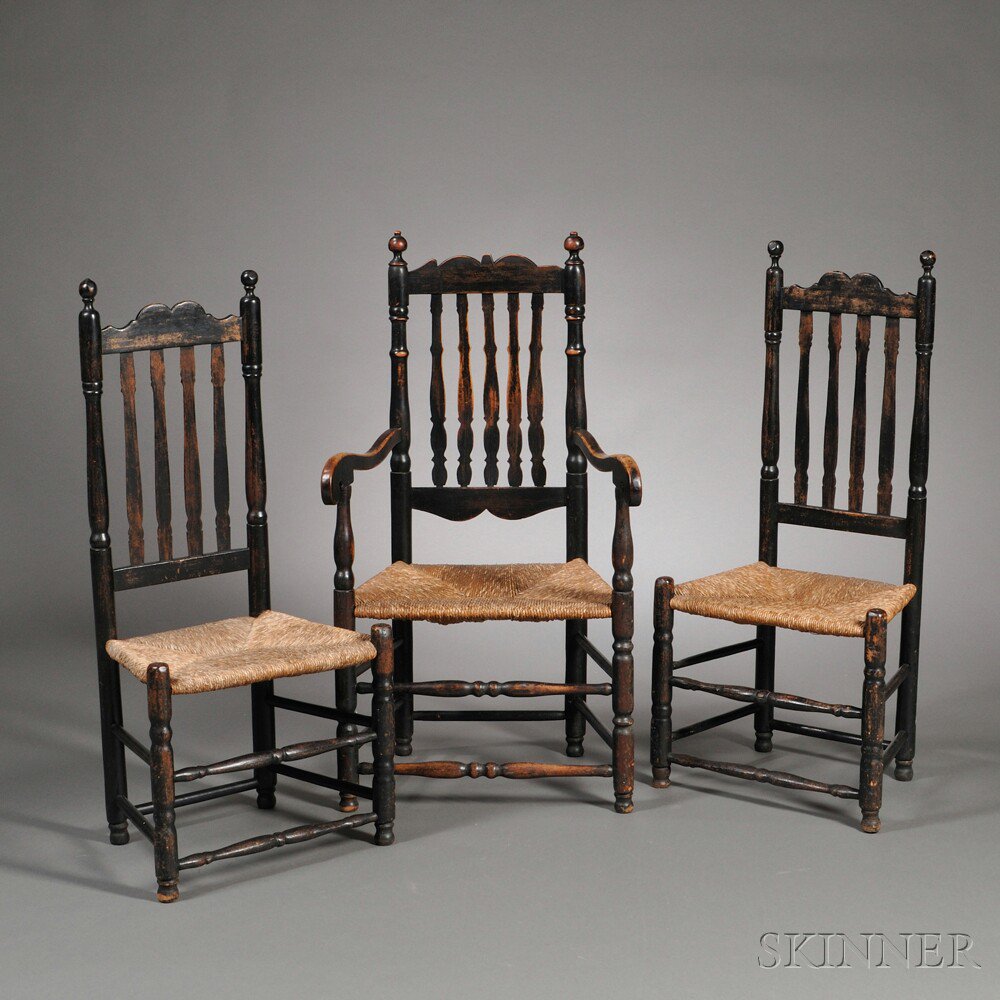 Appraisal: Three Black-painted Bannister-back Chairs New England th century an armchair