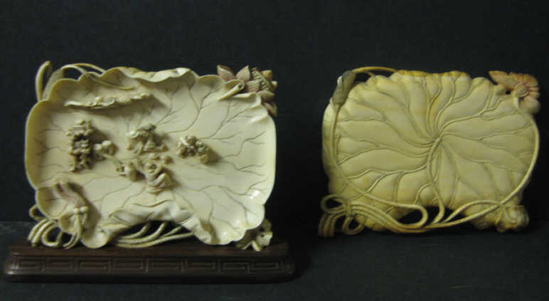 Appraisal: PAIR OF ASIAN IVORY LOTUS FORM PLAQUES Each carved and