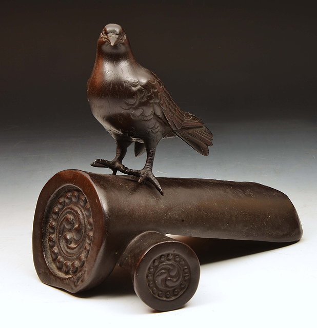 Appraisal: Japanese bronze logwith dove Meiji cm