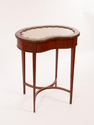 Appraisal: A mahogany kidney-shaped display table on square taper legs united