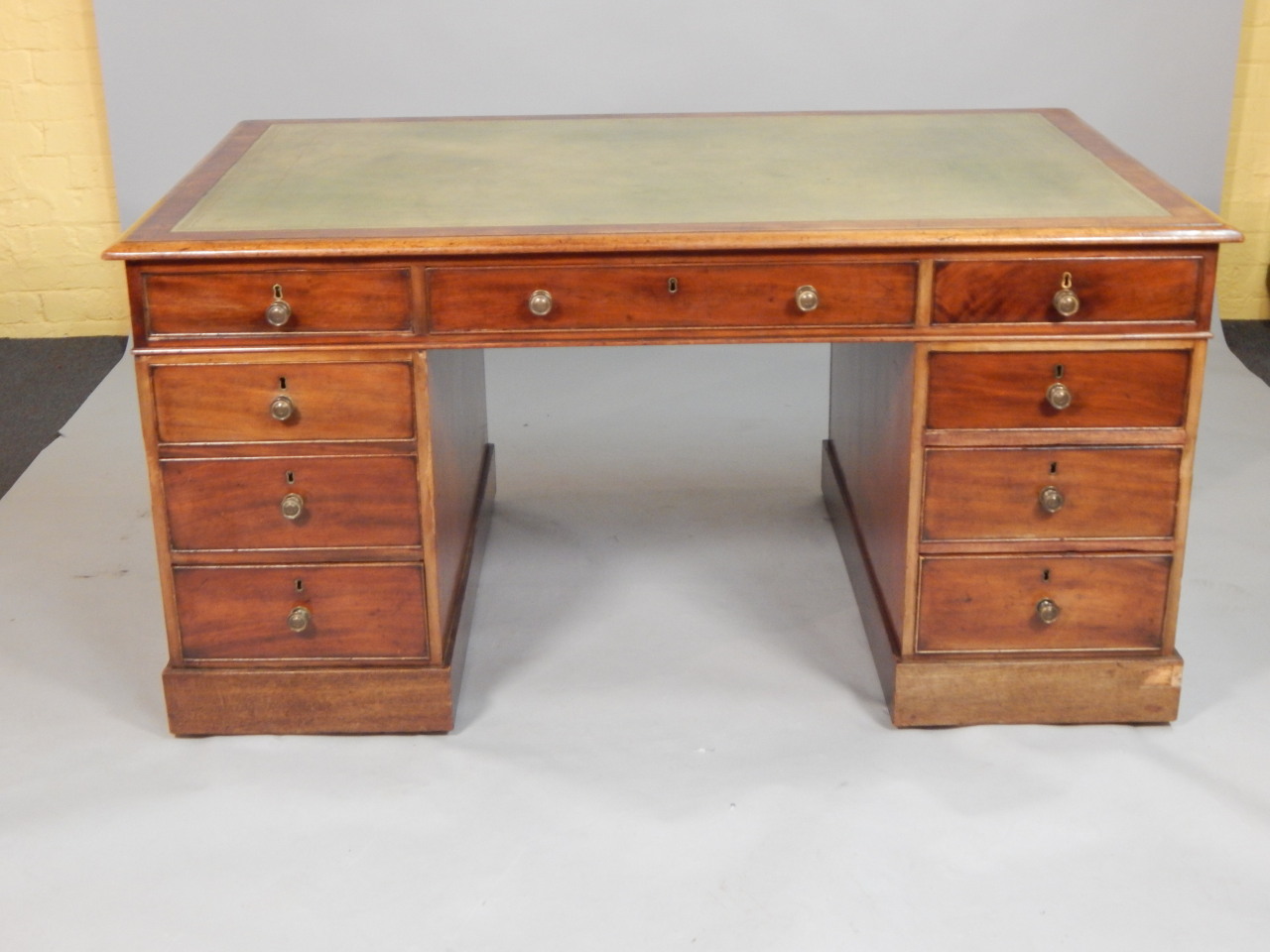 Appraisal: An early thC mahogany partners pedestal desk the top with