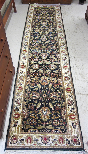 Appraisal: HAND KNOTTED ORIENTAL RUNNER Indo-Persian overall floral Kashan design on