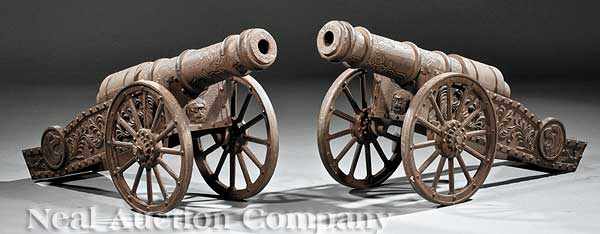 Appraisal: A Pair of Napoleonic-Style Cast Iron Cannons th c elaborately