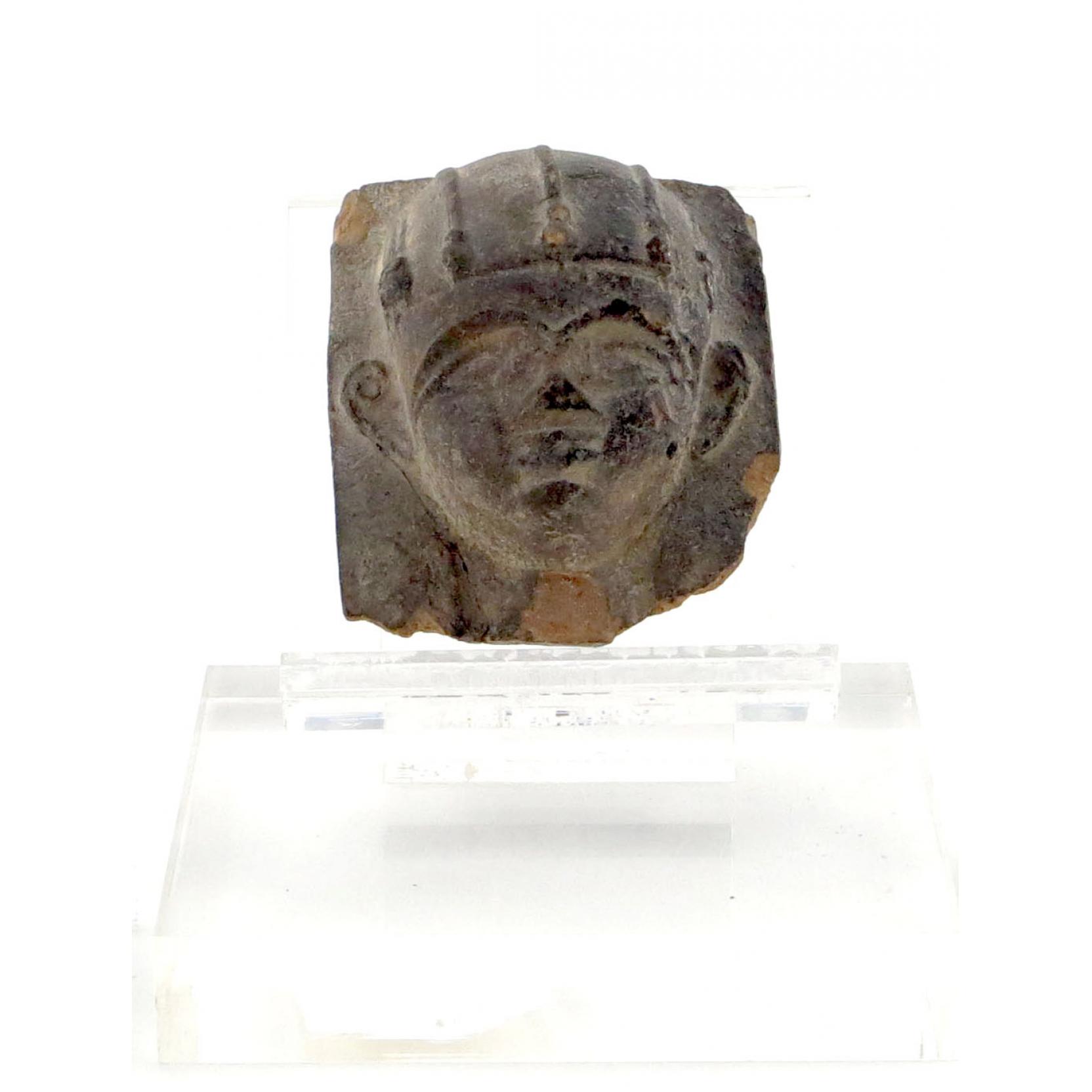 Appraisal: Egyptian Style Sandstone Relief Carved Face mounted on Lucite Some