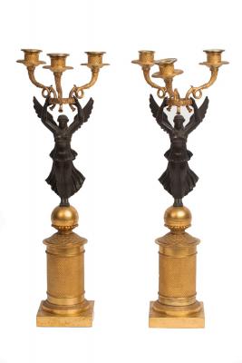 Appraisal: A pair of Empire style three-branch three-light ormolu and bronze