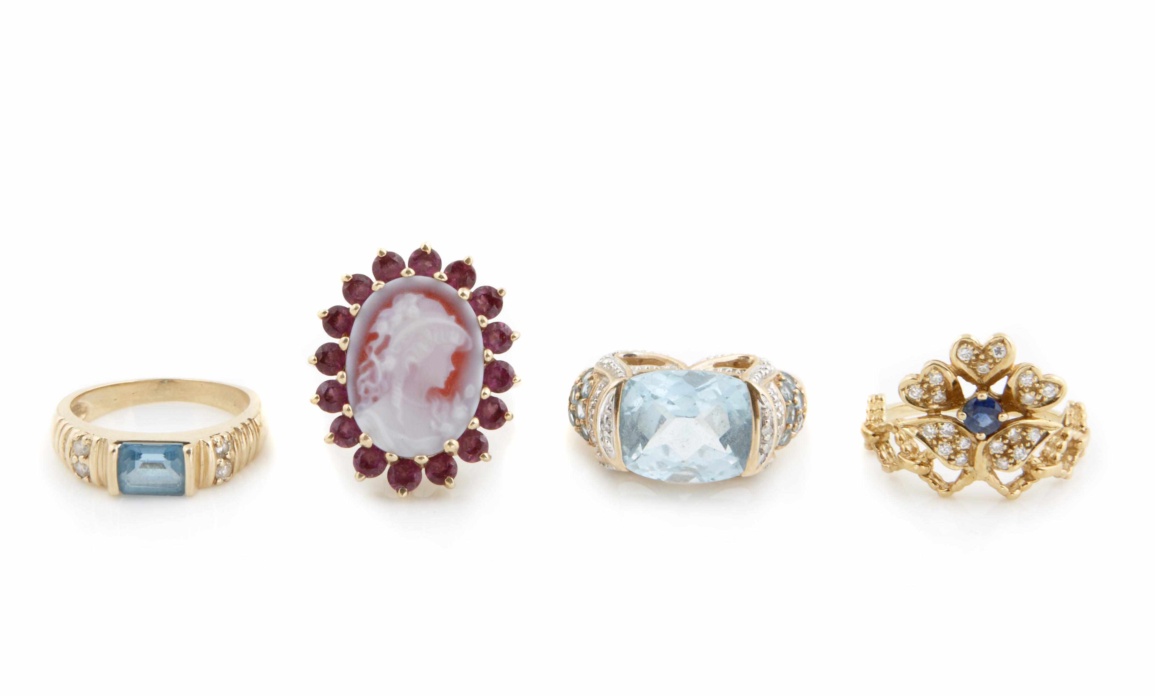 Appraisal: A collection of four diamond gem-set and gold rings including