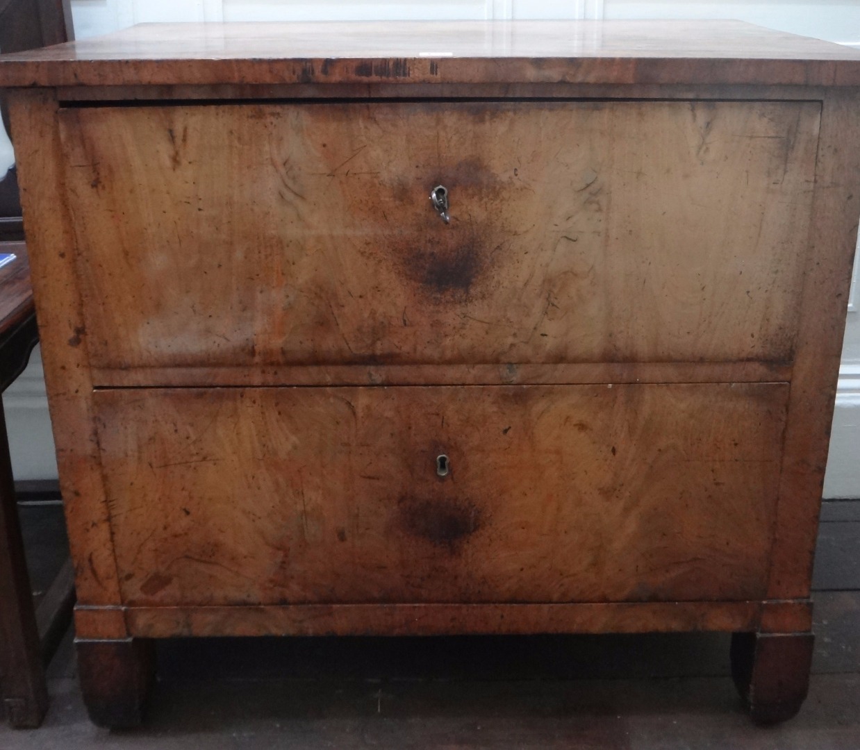 Appraisal: A Biedermeyer mahogany chest of two deep drawers on square