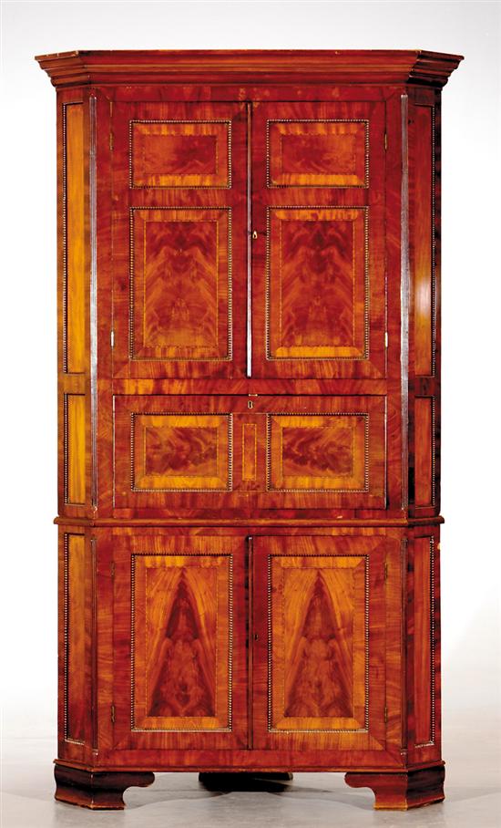 Appraisal: English mahogany secretaire corner cupboard first half th century molded