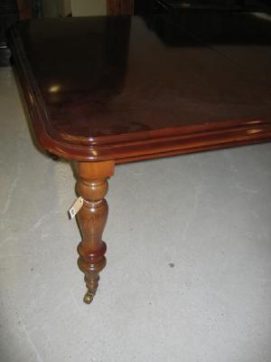 Appraisal: A VICTORIAN MAHOGANY EXTENDING DINING TABLE of rounded oblong form