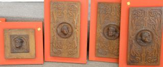 Appraisal: Set of seven carved oak figural plaques sz x to