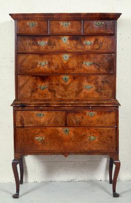 Appraisal: AN EARLY GEORGIAN WALNUT CHEST ON STAND with feather banding