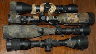 Appraisal: four Simmons rifle Scopes Aetec etc with camo tape some