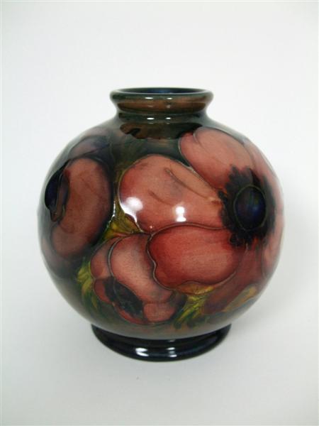 Appraisal: MOORCROFT OVOID MINIATURE VASE CIRCA glazed earthenware tube line decoration