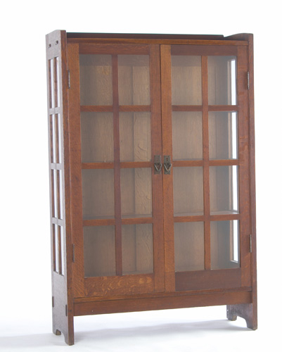 Appraisal: GUSTAV STICKLEY Two-door china cabinet with eight panes per door