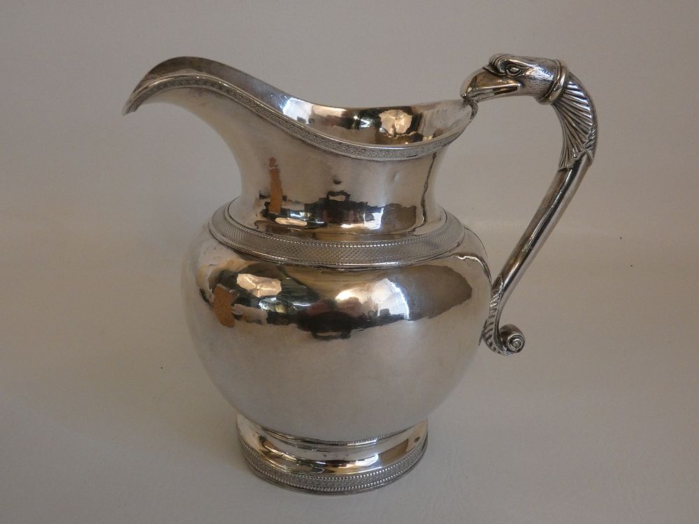 Appraisal: EARLY COIN SILVER EAGLE JUG Circa early 's coin silver