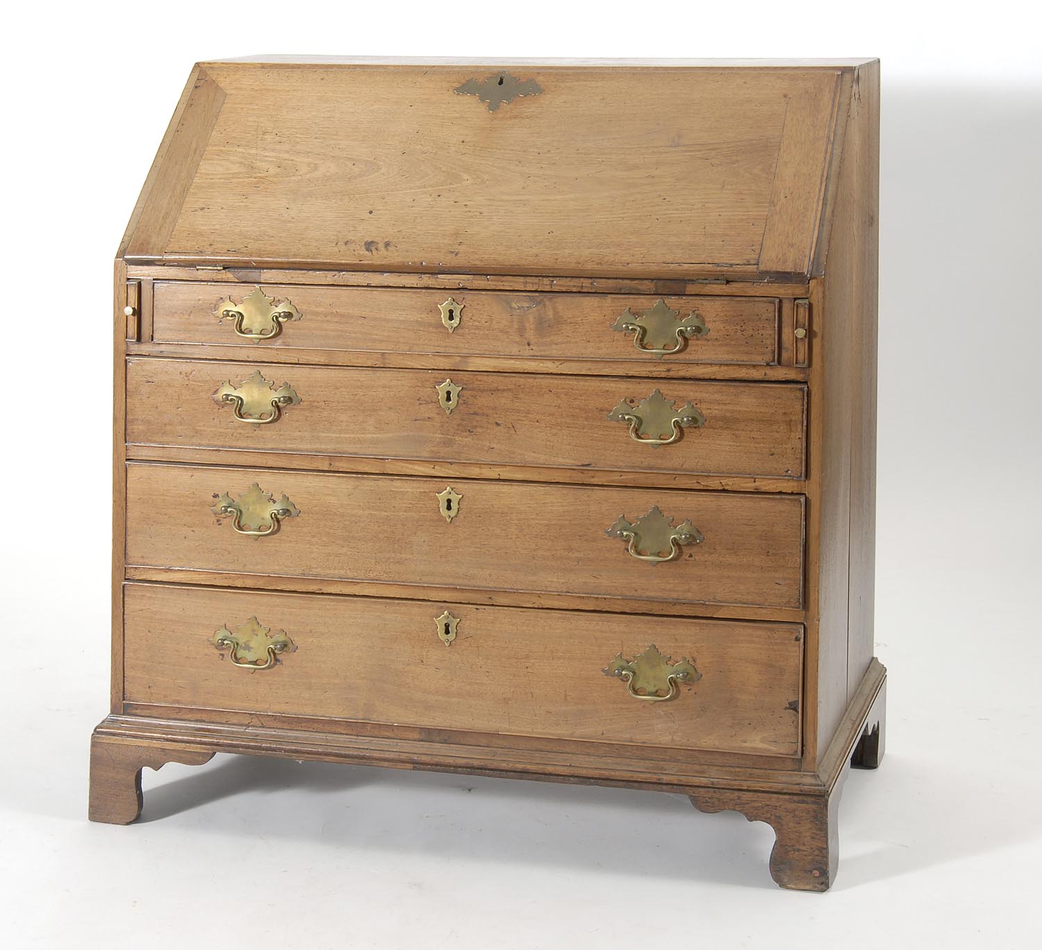 Appraisal: ANTIQUE SLANT-LID DESK in walnut with pigeonhole interior Ogee bracket