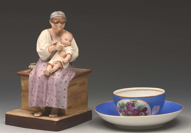 Appraisal: A RUSSIAN BISCUIT PORCELAIN MODEL OF A MOTHER and child