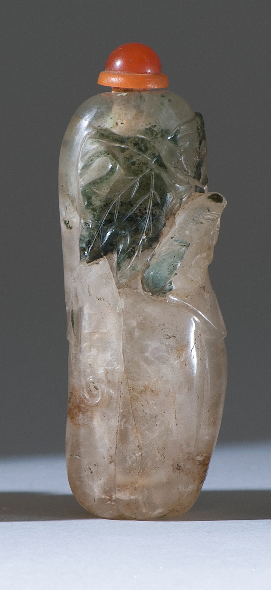 Appraisal: ROCK CRYSTAL SNUFF BOTTLE th CenturyIn gourd form with relief