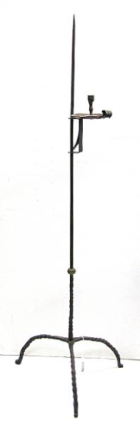 Appraisal: An American wrought iron and brass adjustable candle stand The