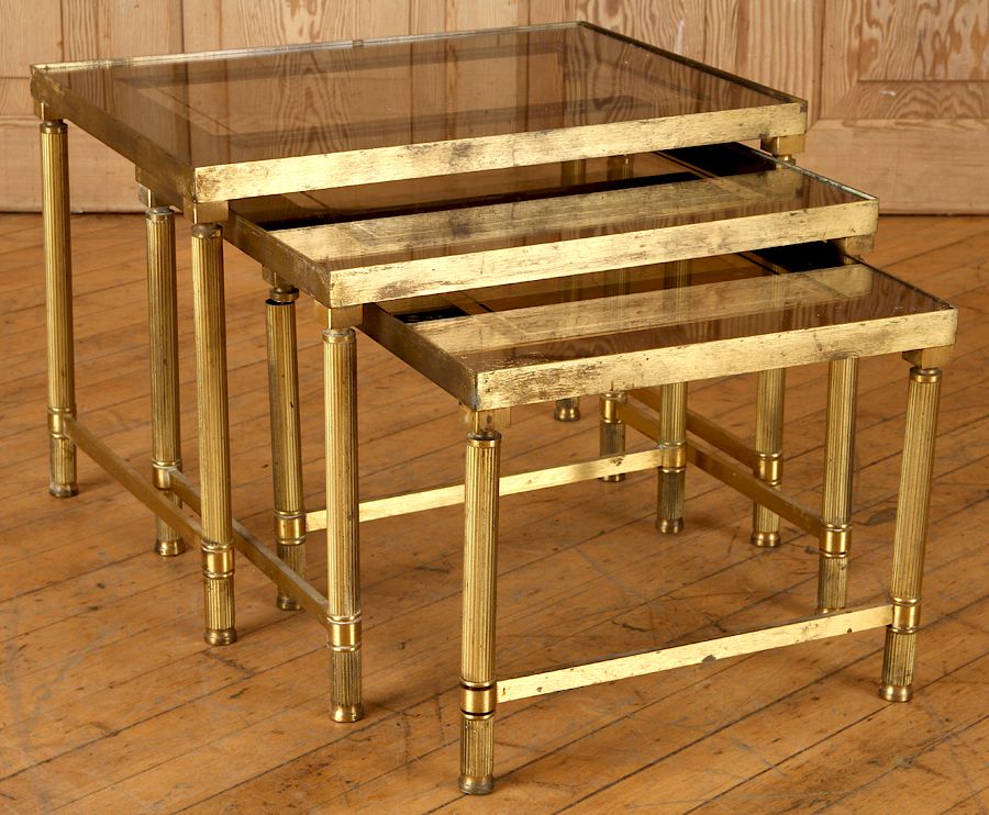 Appraisal: PC BRASS AND SMOKED GLASS NESTING TABLE C A three