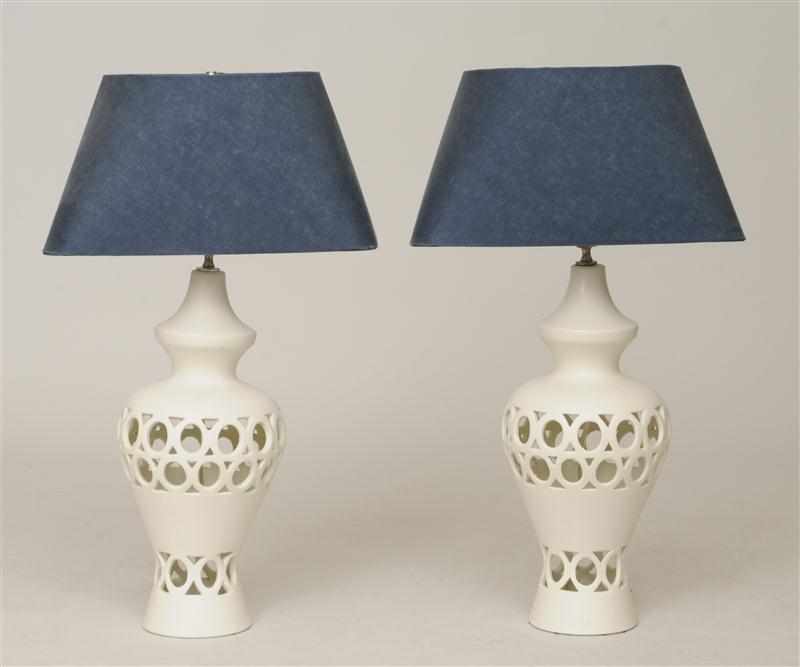 Appraisal: PAIR OF MODERN PIERCED BISQUE BALUSTER-SHAPED LAMPS Provenance Property from