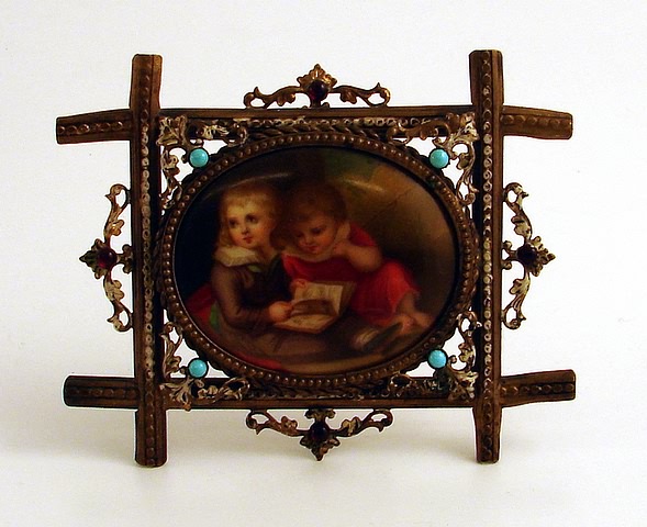 Appraisal: Oval painted porcelain in bejeweled brass frame x miniature Ship