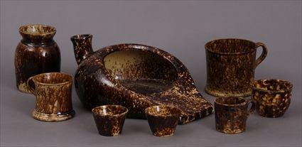 Appraisal: EIGHT ROCKINGHAM-GLAZED POTTERY ARTICLES Including a bedpan cup two large