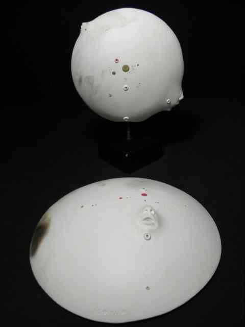 Appraisal: Lot of two contemporary ceramic face sculptures Both feature a