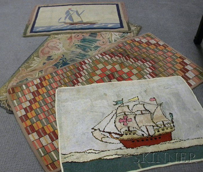 Appraisal: Four Hooked Rugs a floral and scroll pattern geometric squares