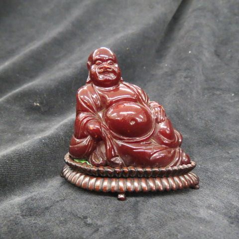 Appraisal: Chinese Carved Cherry Amber Buddha Figurine seated plus carved stand