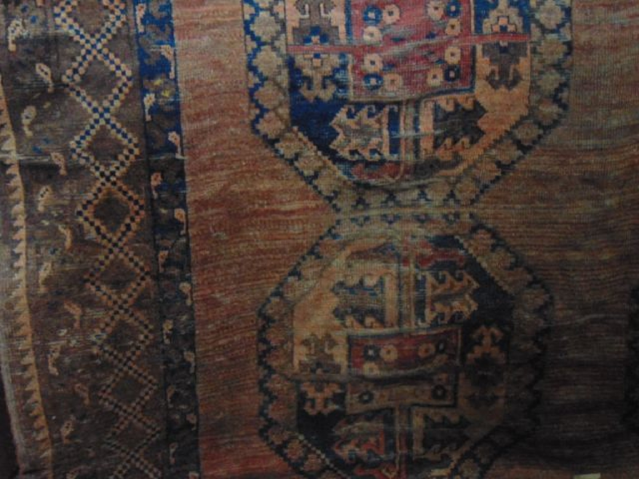 Appraisal: A substantial wool carpet in the Persian manner set within