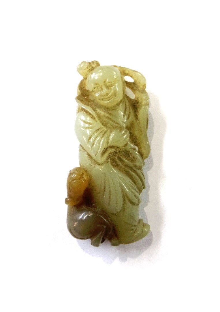 Appraisal: A small Chinese jade figure of a man standing with