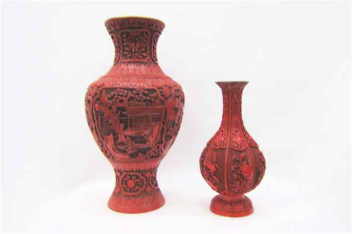 Appraisal: TWO CHINESE RED CINNEBAR VASES each with reserves of carved