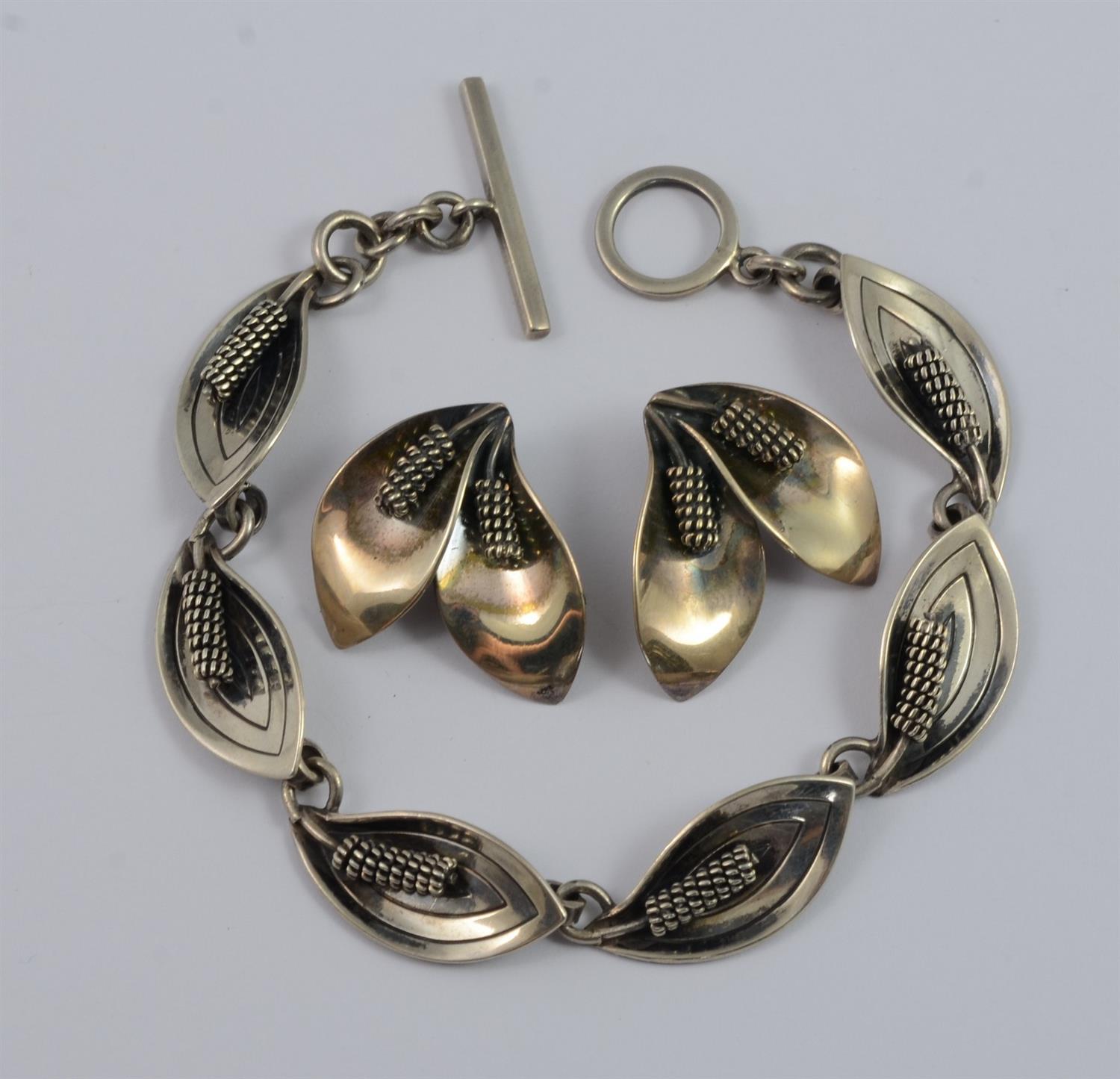 Appraisal: Sterling Silver Bracelet and Earrings Set in Lily Motif clip