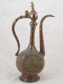 Appraisal: A large heavy copper Islamic ewer decorated overall ht cm