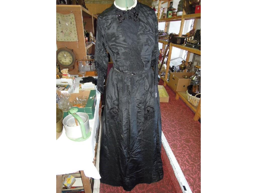 Appraisal: A Victorian black satin mourning skirt with jacket the skirt