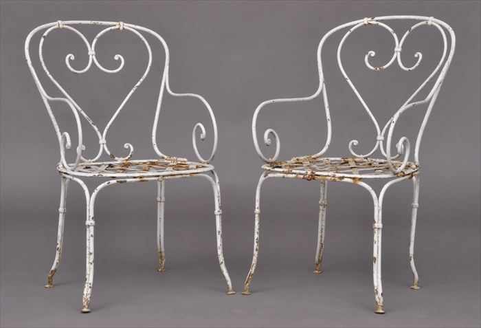 Appraisal: PAIR OF WHITE-PAINTED WROUGHT-IRON GARDEN ARMCHAIRS Each with lattice seat