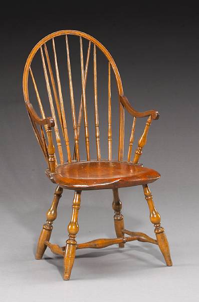 Appraisal: A mixed wood bow back brace back Windsor armchair Rhode